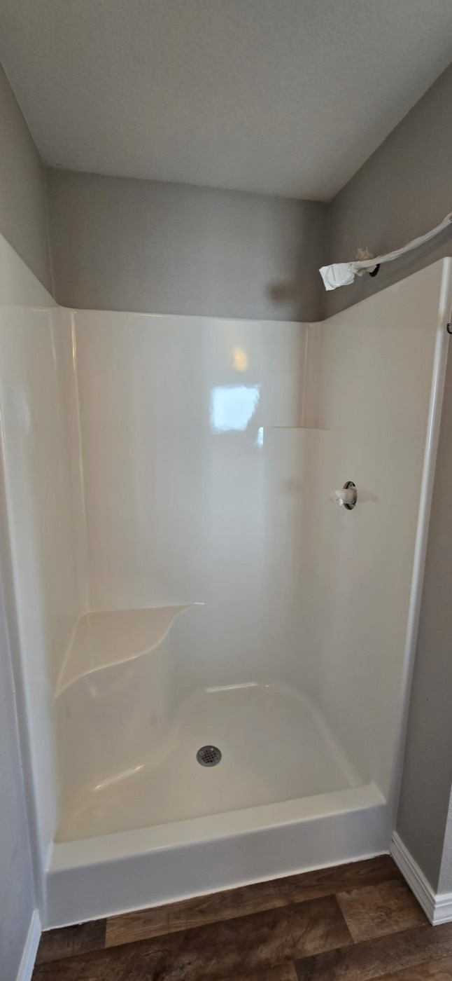 The same shower stall refinished clean and glossy