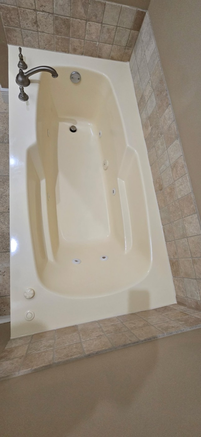 Jetted tub refinished to a glossy cream finish